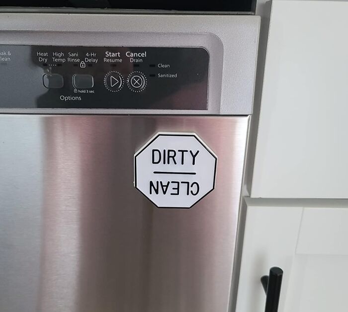 Dishwasher with a magnetic dirty clean sign, illustrating affordable kitchen organization under 5 dollars to save that coin.