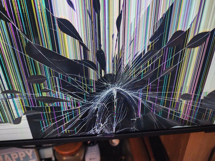 A shattered screen displaying a burst of colorful vertical lines, a clear example of expensive accidents and fails.