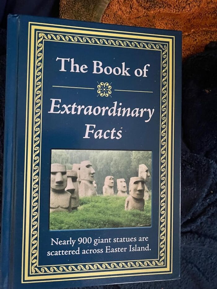 Book titled "The Book of Extraordinary Facts" with Easter Island statues image.