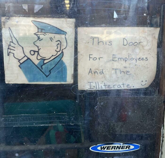 Funny sign with cartoon officer and text: "This door for employees and the illiterate."