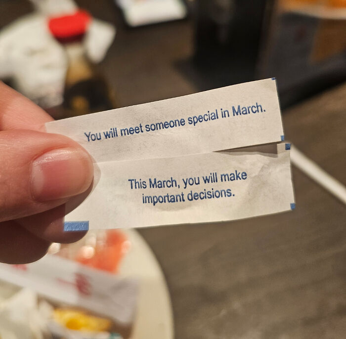 Close-up of two fortune cookie messages about March, shared as a moderately interesting moment by people worldwide.