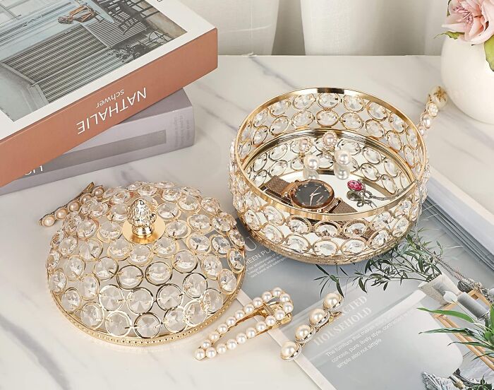 Decorative jewelry box and accessories on marble surface showcasing expensive taste with a humble budget style.