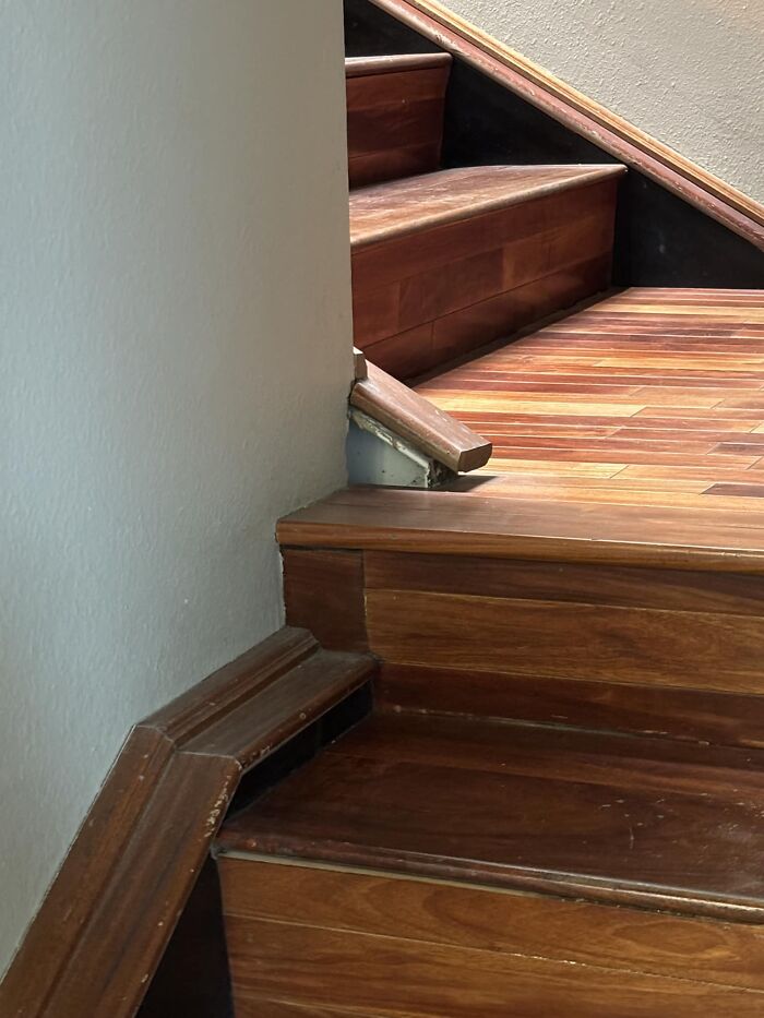 Steep wooden stairs with uneven steps, highlighting the risk and the reason some might prefer elevators.