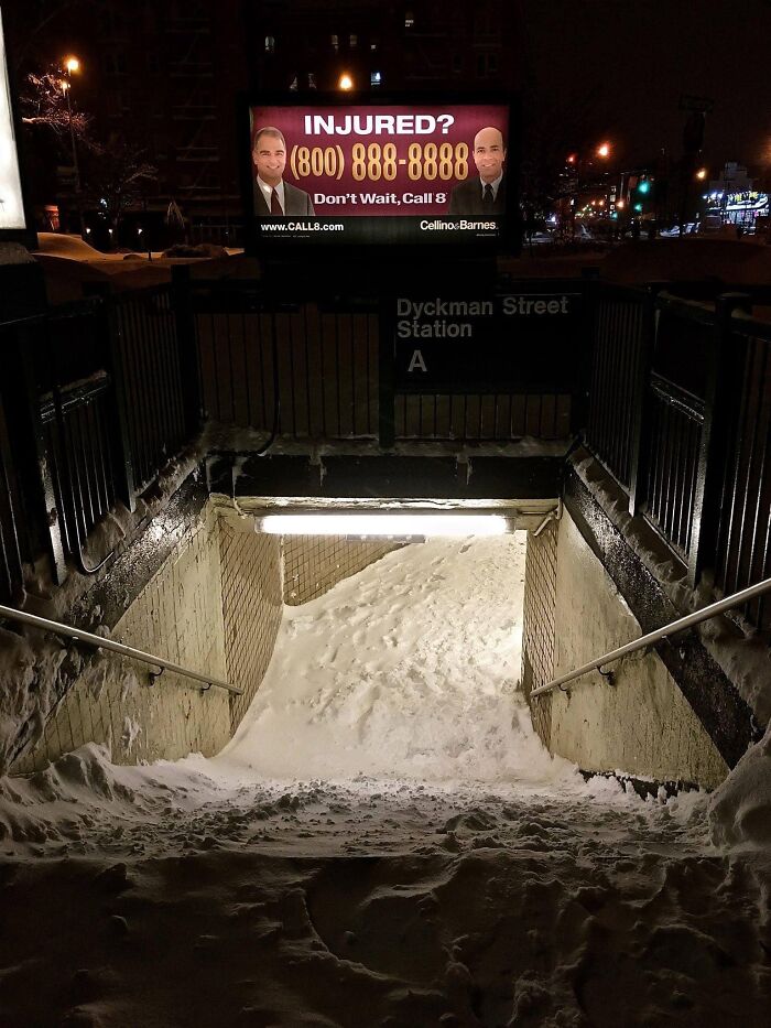 Snow-covered stairs at Dyckman Street Station, slippery and treacherous, suggest opting for elevators.