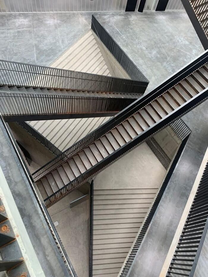 Complex staircases intersecting at various angles, embodying the concept of "death stairs."