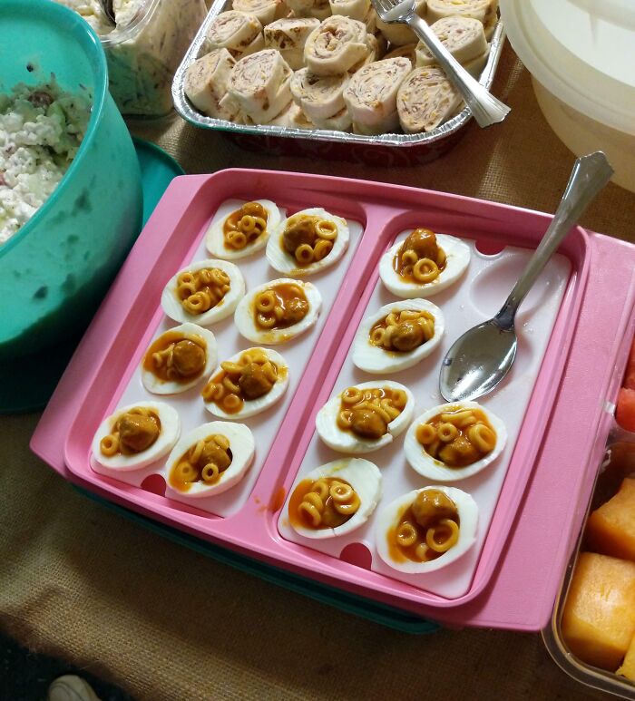 Deviled eggs topped with canned spaghetti as a budget wedding fail dish.