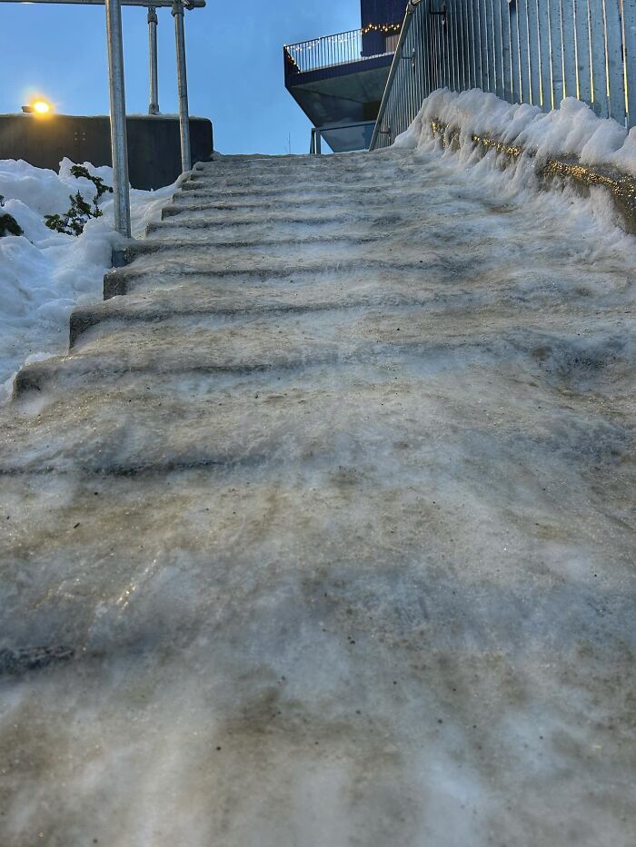 Icy "death stairs" covered in snow and ice, a safety hazard in winter weather.