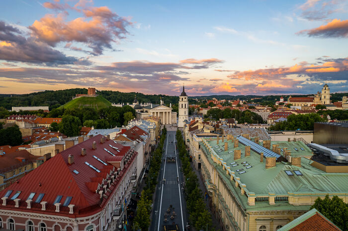 Bird’s-eye view of Vilnius, Lithuania, showcasing Gediminas Tower and Vilnius Cathedral at sunset.