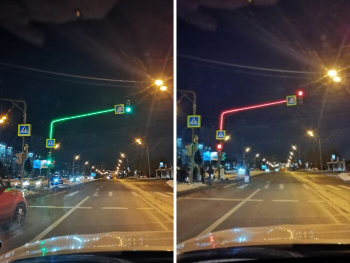 Traffic lights with illuminated poles at night, showcasing cities-genius-solutions in urban design.