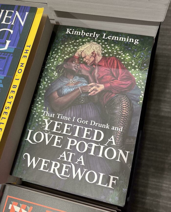 Terrible book cover featuring a couple amidst flowers, titled "Yeeted a Love Potion at a Werewolf."