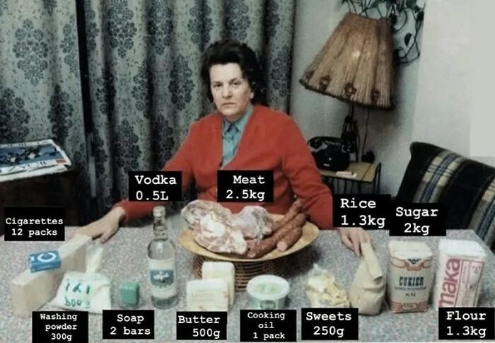 Woman with various grocery items on a table, including vodka, meat, and flour, showing something interesting not commonly seen before.