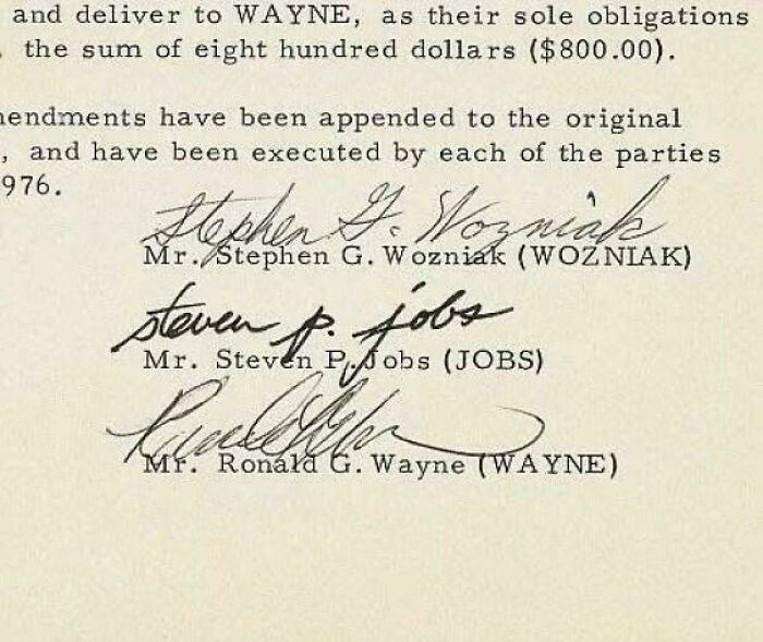 Signatures of Stephen Wozniak, Steven Jobs, and Ronald Wayne on a historical document showing something interesting.
