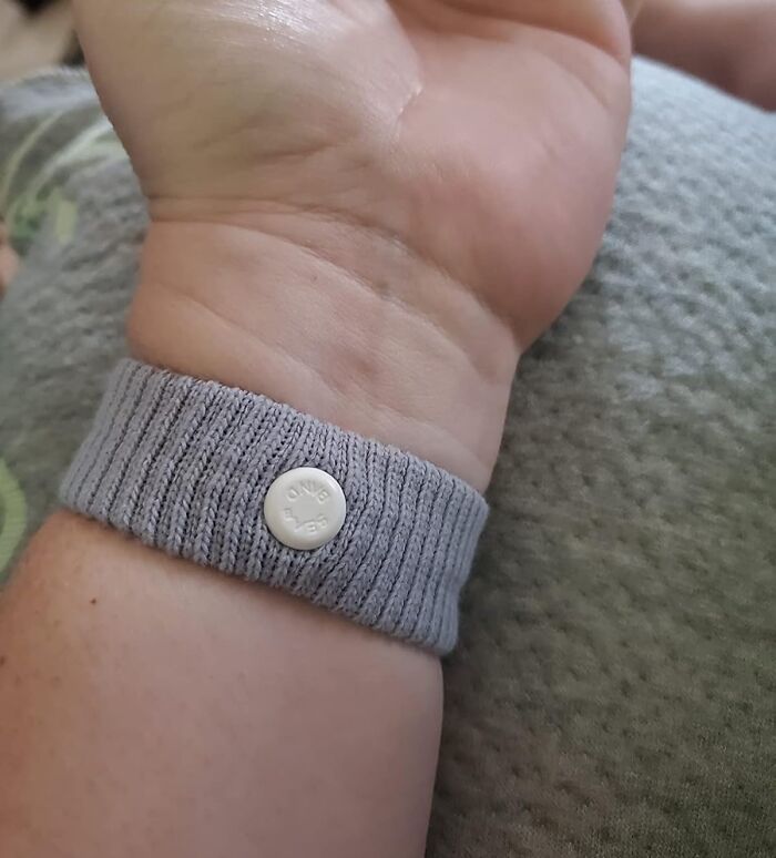 Gray wristband on a person's wrist, related to genius Amazon finds.