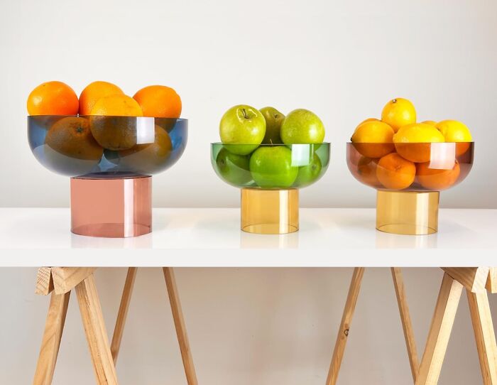 Colorful fruit bowls on a white table bring inexplicable joy.