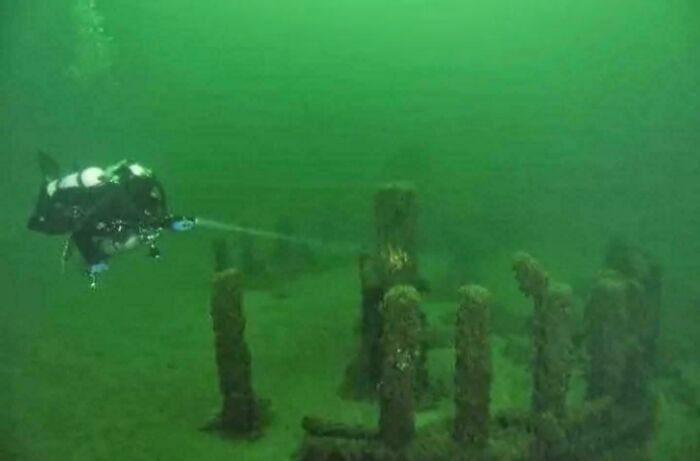 Underwater robot explores bizarre submerged structure.