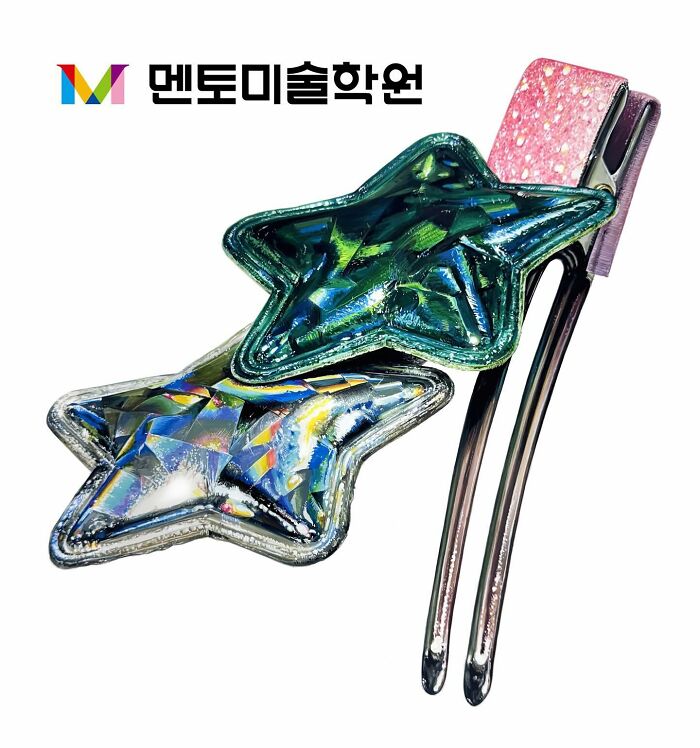 Hyperrealistic painting of two star-shaped hair clips with metallic textures.