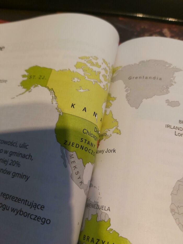 Map in a poorly-written-designed book with incorrect labels for North America and Greenland.