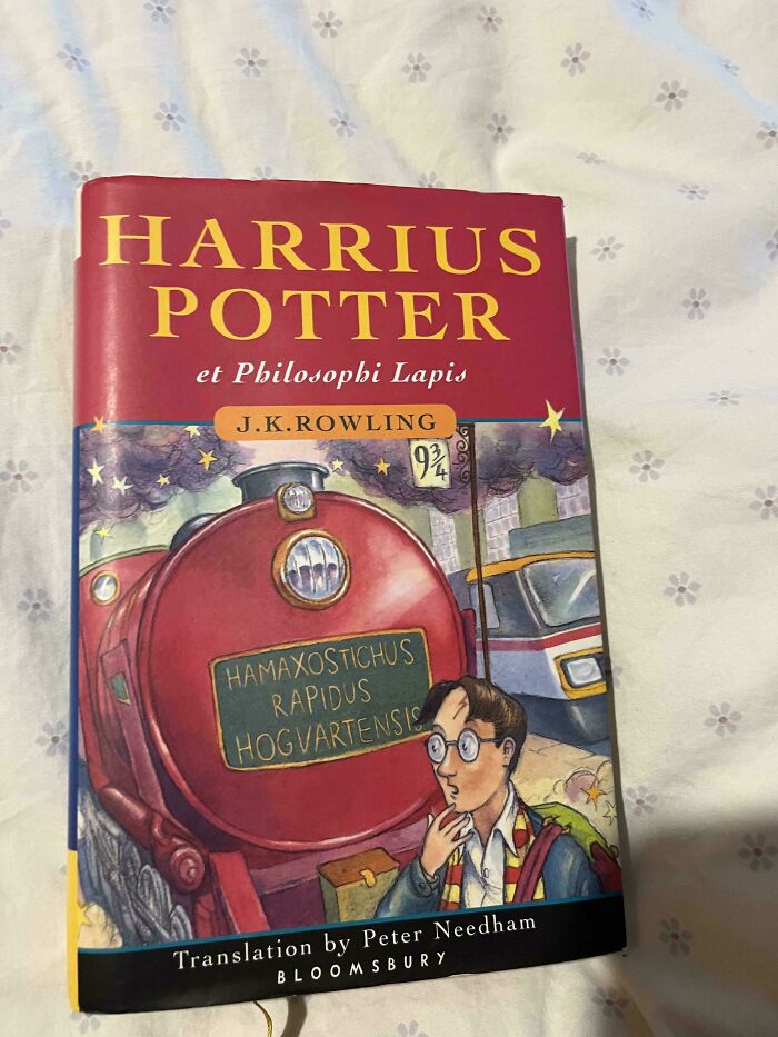 Book cover of "Harrius Potter et Philosophi Lapis" on a floral background, related to poorly-written-designed-books.