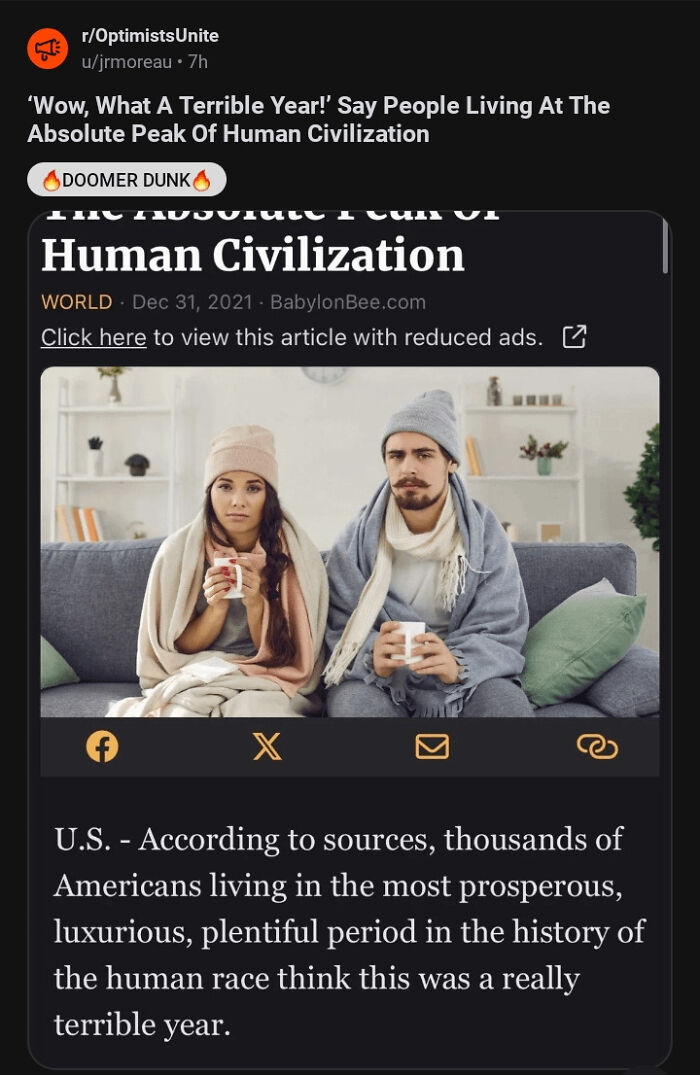 Couple with mugs dressed warmly on sofa, reacting to satirical news headline about a peak year in civilization.