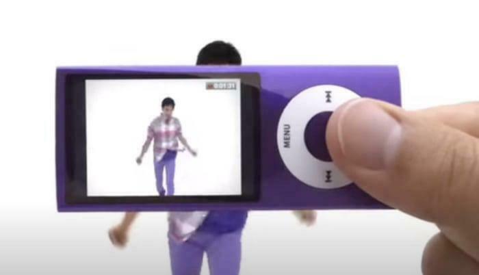 Purple iPod Nano displaying a dance video, evoking 2000s nostalgia with its classic design and UI.