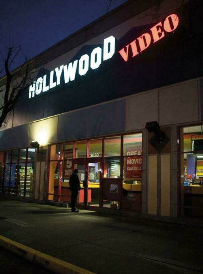 Hollywood Video storefront at night, evoking 2000s nostalgia.