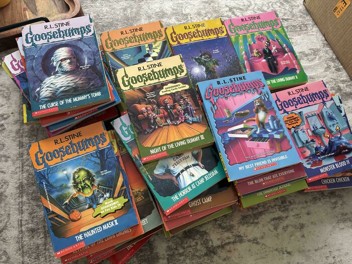 Goosebumps books from the 2000s spread on a table, including "The Haunted Mask II" and "Monster Blood III."