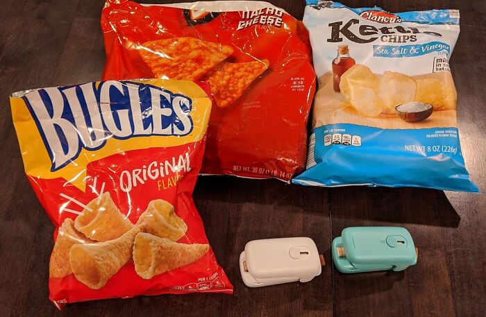 Snack bag sealers next to bags of chips, a clever invention for keeping snacks fresh and frustration-free.