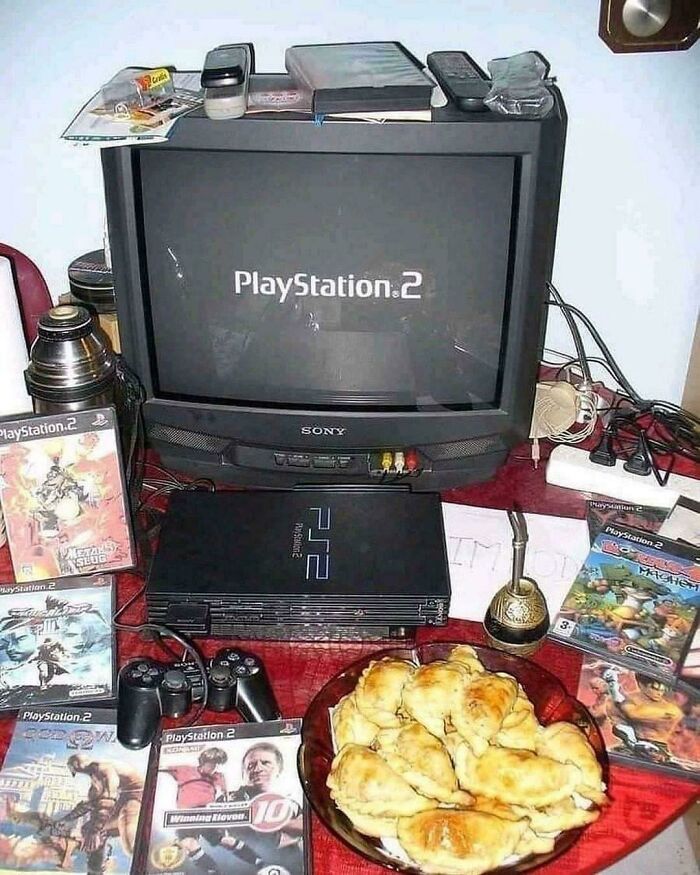 PlayStation 2 setup with games, snacks, and a vintage TV, capturing a nostalgic 2000s vibe.