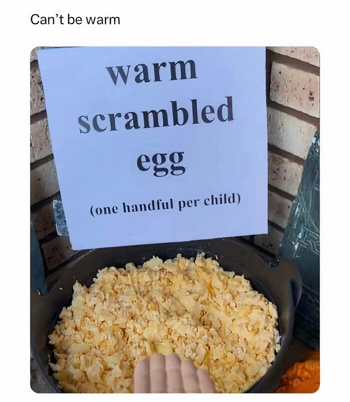 Sign above a pot of scrambled eggs in a humorous meme setting.