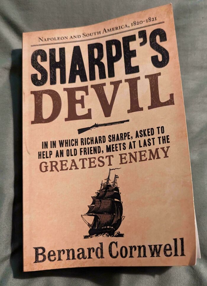 Cover of "Sharpe's Devil" by Bernard Cornwell, featuring a ship illustration, related to poorly-written-designed-books.