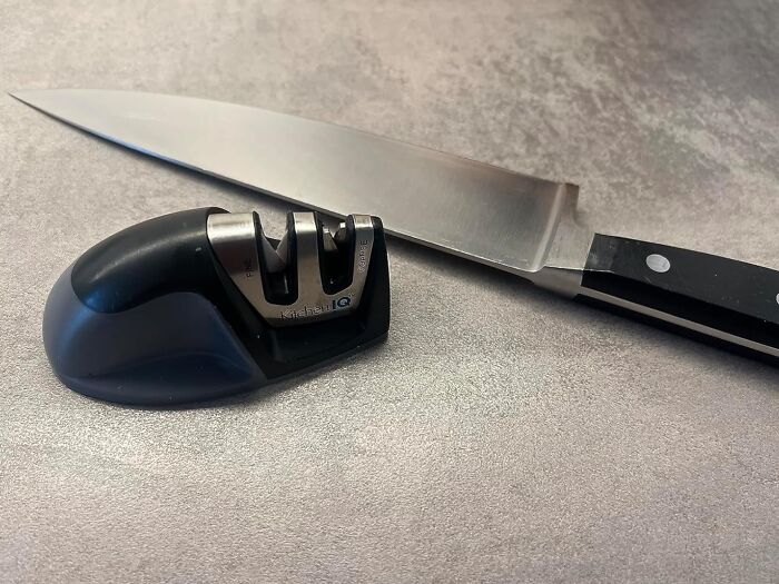 Knife with sharpener on a countertop, highlighting items worth every cent long term.
