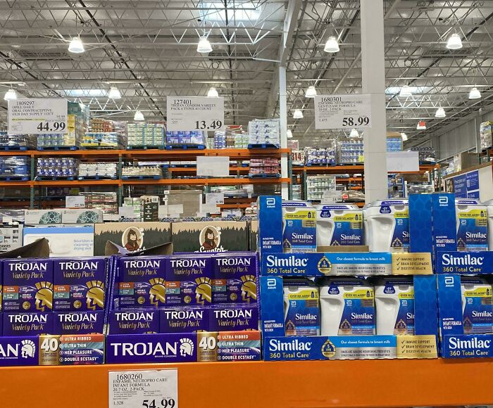 Store shelves stocked with parenting products including infant formula and variety packs, showing dads doing their best parenting moments.