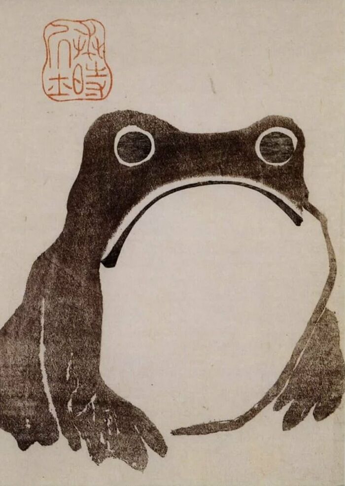 Ancient artefact depicting a minimalist frog design, highlighting historical art techniques.