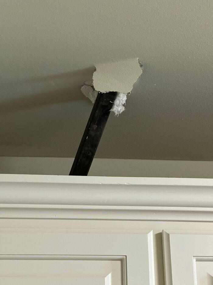 Mystery object protruding through ceiling, causing curiosity and confusion.