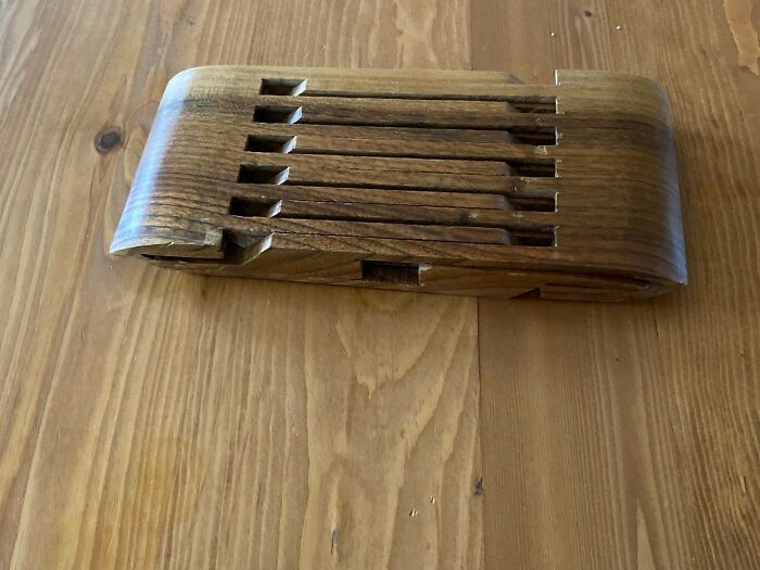 Wooden object with a segmented, slotted design, found and shared under "weird objects" discovery theme.