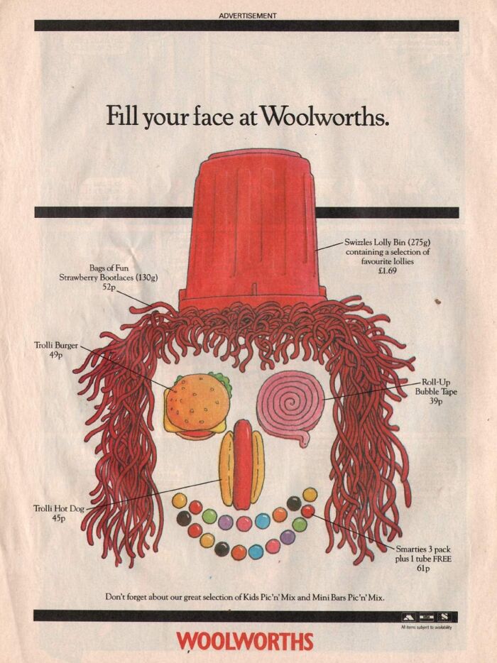 Vintage-Commercials Woolworths ad with candy forming a face, featuring strawberry laces and a Swizzles lolly bin.