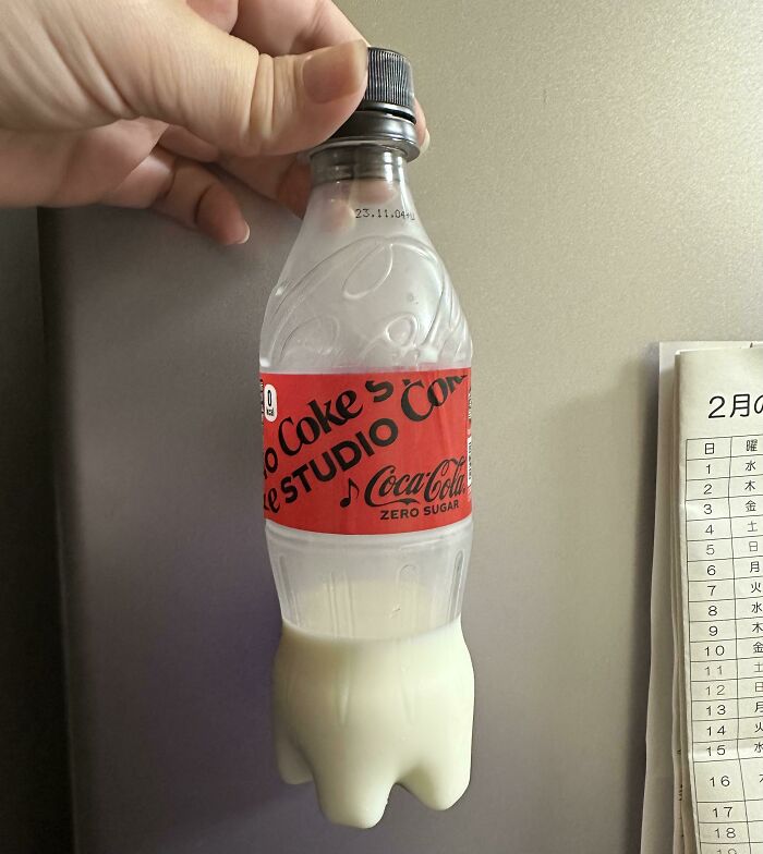 Coke bottle filled with milk, illustrating annoying boyfriends and husbands' pranks.