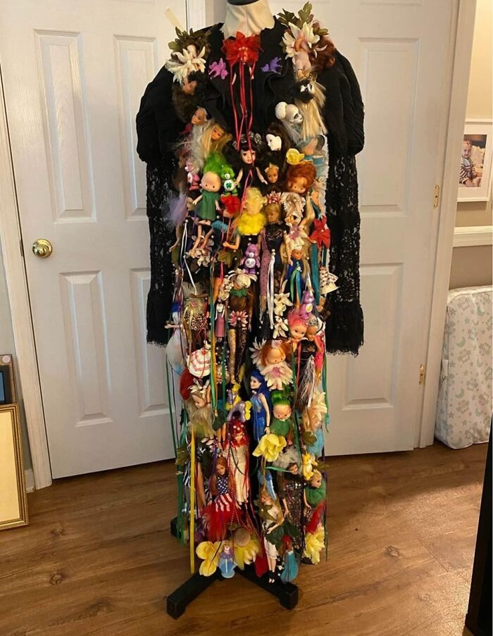 DIY project display with numerous colorful dolls attached to a dress form, set in a home interior.