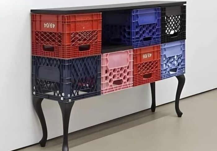 DIY furniture project using colorful plastic crates with black legs, showcasing a unique yet questionable craft design.