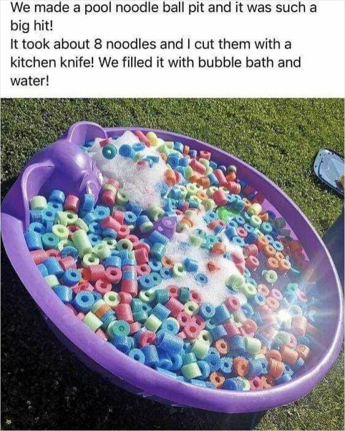 DIY project with a kiddie pool filled with colorful pool noodle pieces and bubbles on grass.