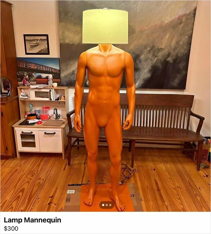 Mannequin with a lampshade head in a room, illustrating a horrendous DIY project for craft shaming.