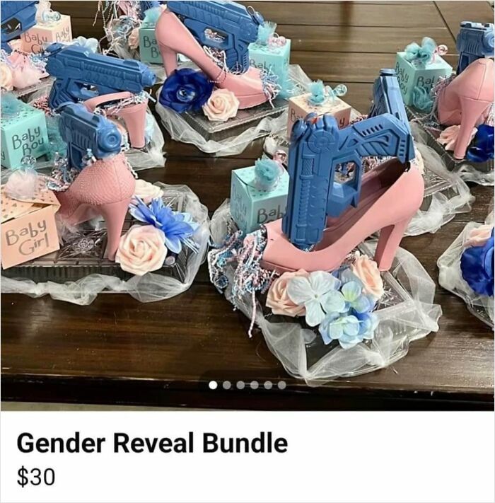 DIY craft project with pink heels and blue toy guns displayed on a table.