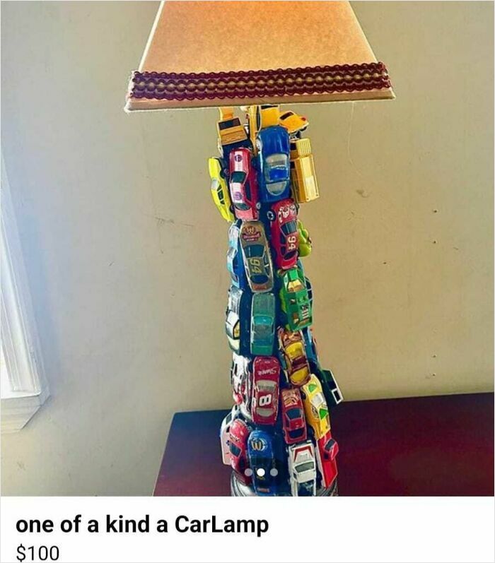 DIY lamp made with toy cars stacked as the base, showcasing a unique yet questionable craft design.