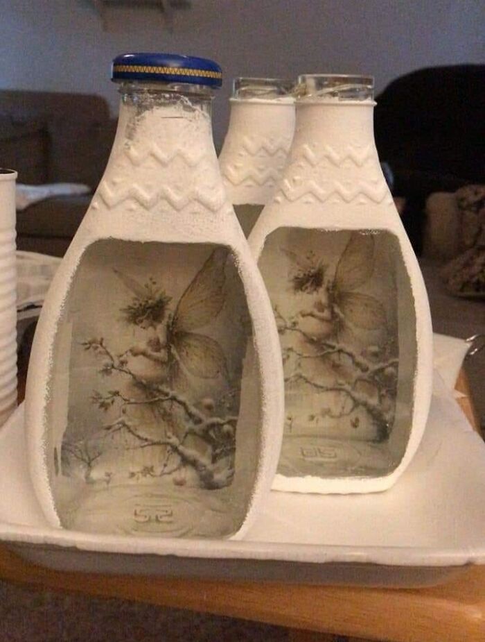DIY craft project featuring decorated bottles with fairy images inside, needing some craft shaming for its unusual design.
