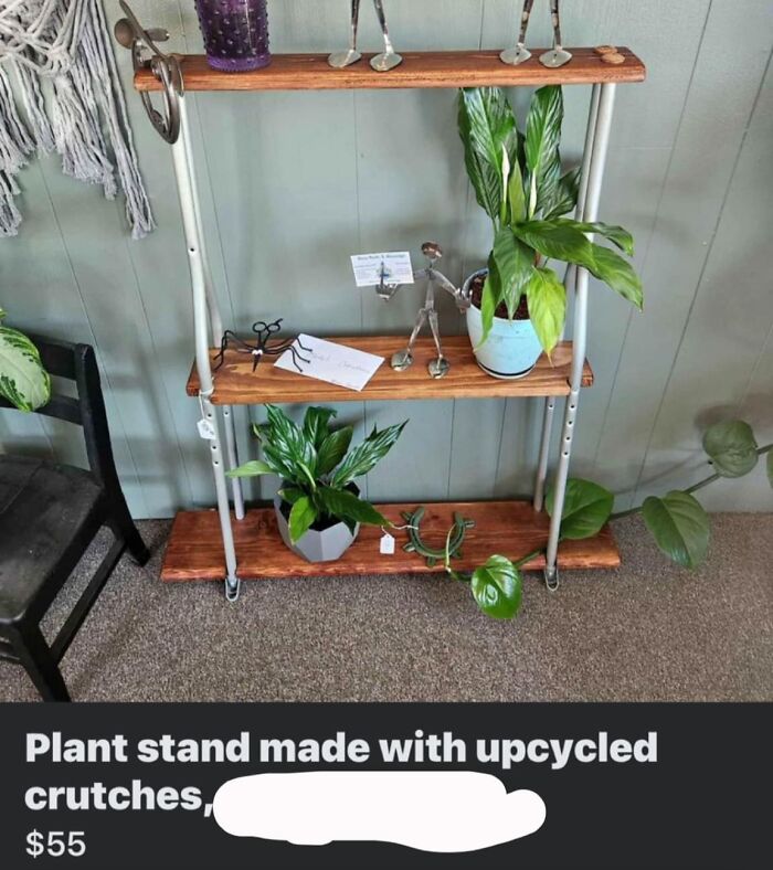 Upcycled crutches DIY plant stand with wood shelves and greenery.