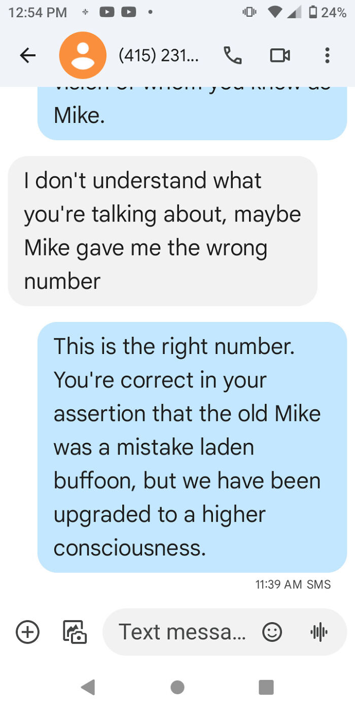Humorous wrong number text exchange discussing Mike's consciousness upgrade.