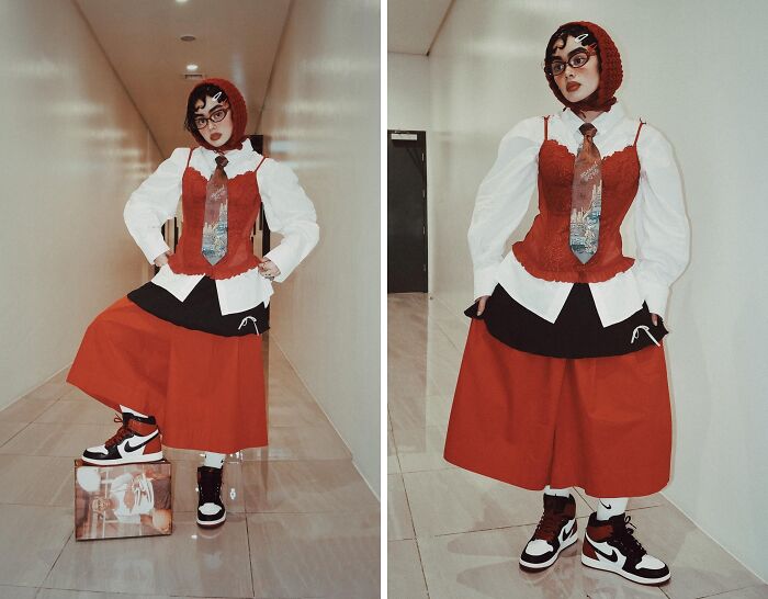 Fashion risk taking: person wears eclectic red and white outfit with sneakers, blending various styles boldly.