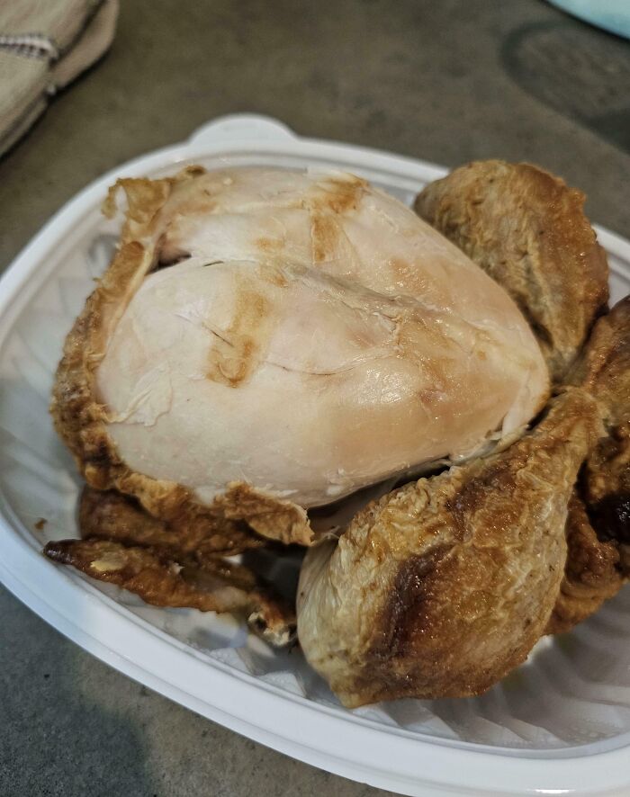 Cooked chicken parts on a white tray, possibly from a meal prepared by annoying boyfriends or husbands.