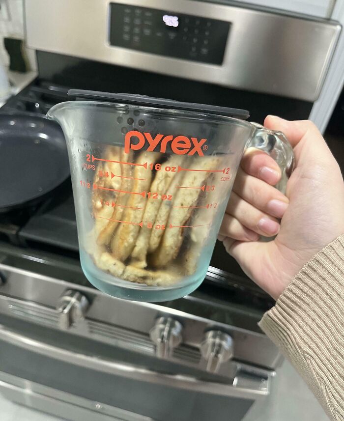 Pyrex measuring cup with cookies inside, illustrating annoying boyfriends or husbands' kitchen habits.