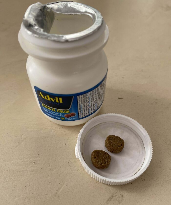 Advil bottle with two pills on a lid, showcasing annoying boyfriends or husbands' quirks.